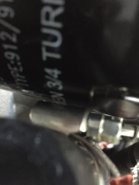 Hose clamp touches oil filter.JPG